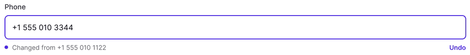 The Phone field in its changed state: the new number in a highlighted input, with “Changed from +1 555 010 1122” and an Undo link beneath it.